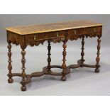 An early 20th century William and Mary style walnut side table with feather and crossbanded borders,