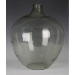 A clear glass carboy, height 54cm, diameter 47cm.Buyer’s Premium 29.4% (including VAT @ 20%) of