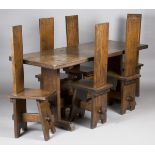 A mid-20th century Arts and Crafts style oak refectory table and six matching chairs, height of
