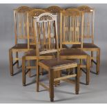 A set of six Edwardian Arts and Crafts oak framed dining chairs, possibly by Wylie & Lochhead, the