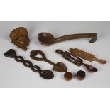 A small group of treen items, including a small 19th century carved pine amorino wall bracket, width