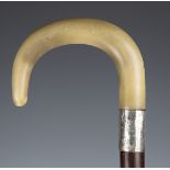 An early 20th century hardwood rhino horn handled walking stick with silver collar, London 1924,