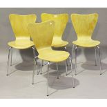 A set of four modern beech-faced ply and chromium plated tubular metal 'ant' chairs, after a