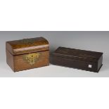 A late Victorian oak and brass mounted dome-topped tea caddy, the interior with twin-lidded