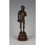 A late 19th century Continental brown patinated cast bronze figure of a Roman soldier holding a