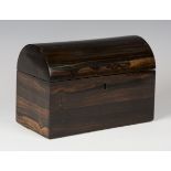 A Victorian coromandel dome-topped tea caddy, the interior fitted with two lidded compartments,
