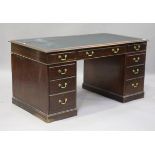 A mid-20th century reproduction mahogany twin-pedestal desk, fitted with an arrangement of nine