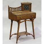 An Edwardian Arts and Crafts stained ash writing table, in the manner of Liberty & Co, the gallery