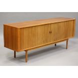 A mid-20th century Danish teak sideboard, designed by Jens Quistgaard for Peter Long, the two