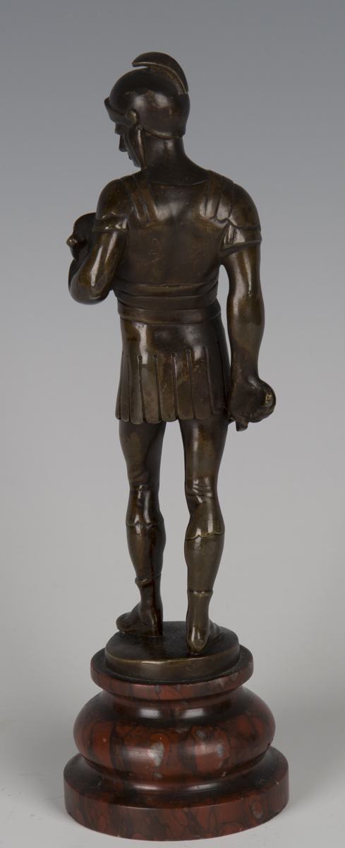 A late 19th century Continental brown patinated cast bronze figure of a Roman soldier holding a - Image 3 of 4