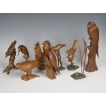 A group of eight mid/late 20th century carved wooden models of birds, each finely modelled