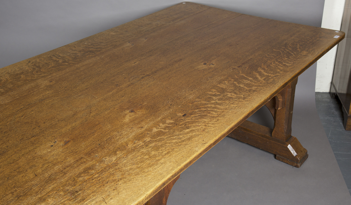 A large early 20th century Arts and Crafts oak refectory table, the rectangular top above eight - Image 2 of 4