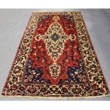 A Bakhtiari carpet, North-west Persia, early/mid-20th century, the red field with a shaped ivory