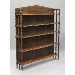 A Regency mahogany five-tier open bookcase with arched frieze and turned supports, height 166cm,