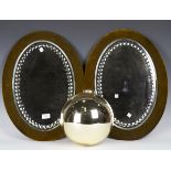 A pair of late Victorian oval facet cut wall mirrors, mounted on velvet backboards, 56cm x 40cm,