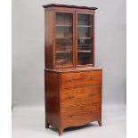 An early Victorian mahogany secrétaire bookcase cabinet, the glazed top enclosing three adjustable