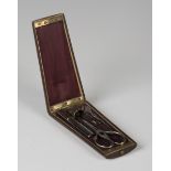A 19th century French walnut and boxwood inlaid étui, the hinged lid enclosing a fitted interior