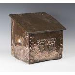 A late 19th/early 20th century Arts and Crafts copper mounted log box, the sloping hinged lid worked