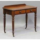 A mid-Victorian mahogany side table, raised on turned and reeded legs fitted with china castors,