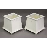 A pair of 20th century white painted wooden plant pot holders of square section, height 36cm,