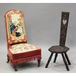 A Victorian nursing chair, the seat and back covered in a period woolwork, on turned legs and