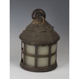 An early 20th century Arts and Crafts patinated tin cylindrical hall lantern, in the manner of