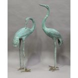 A pair of late 20th century verdigris cast bronze garden models of standing cranes, height 143cm (
