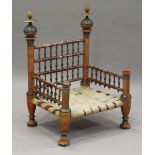 A late 19th/early 20th century Indian painted and turned wooden wedding chair with woven strap seat,
