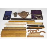 A group of mixed collectors' items, including a selection of technical drawing instruments, a