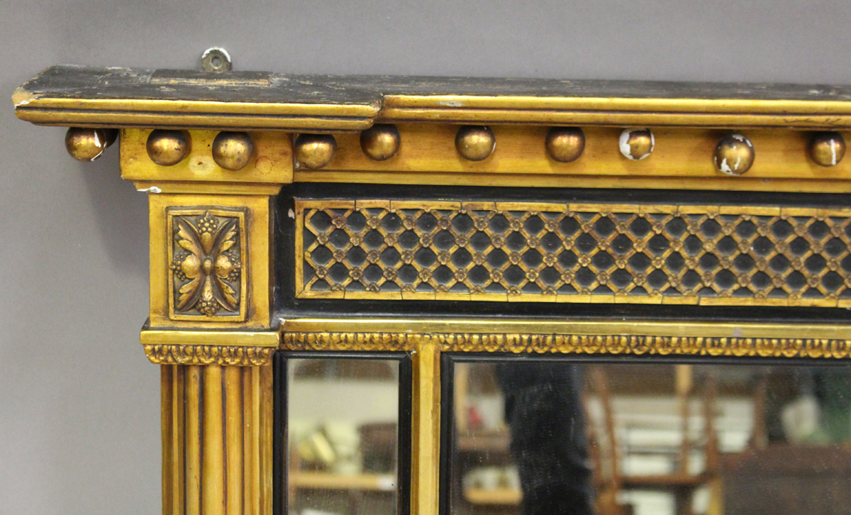 A 19th century Regency style gilt and ebonized overmantel mirror, the ballshot pediment above a - Image 3 of 3