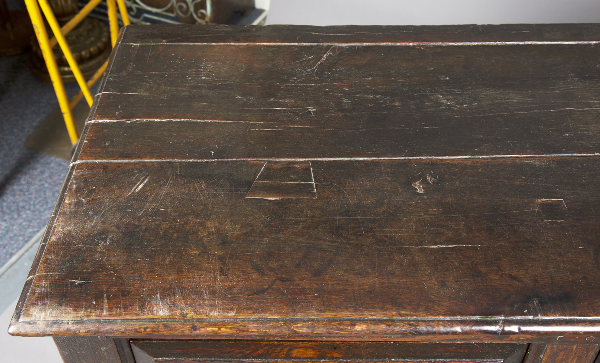 A mid-18th century provincial oak dresser base, fitted with three drawers above arched panel - Image 4 of 4