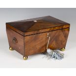 A Regency figured mahogany workbox of sarcophagus form with overall ebony stringing, the interior