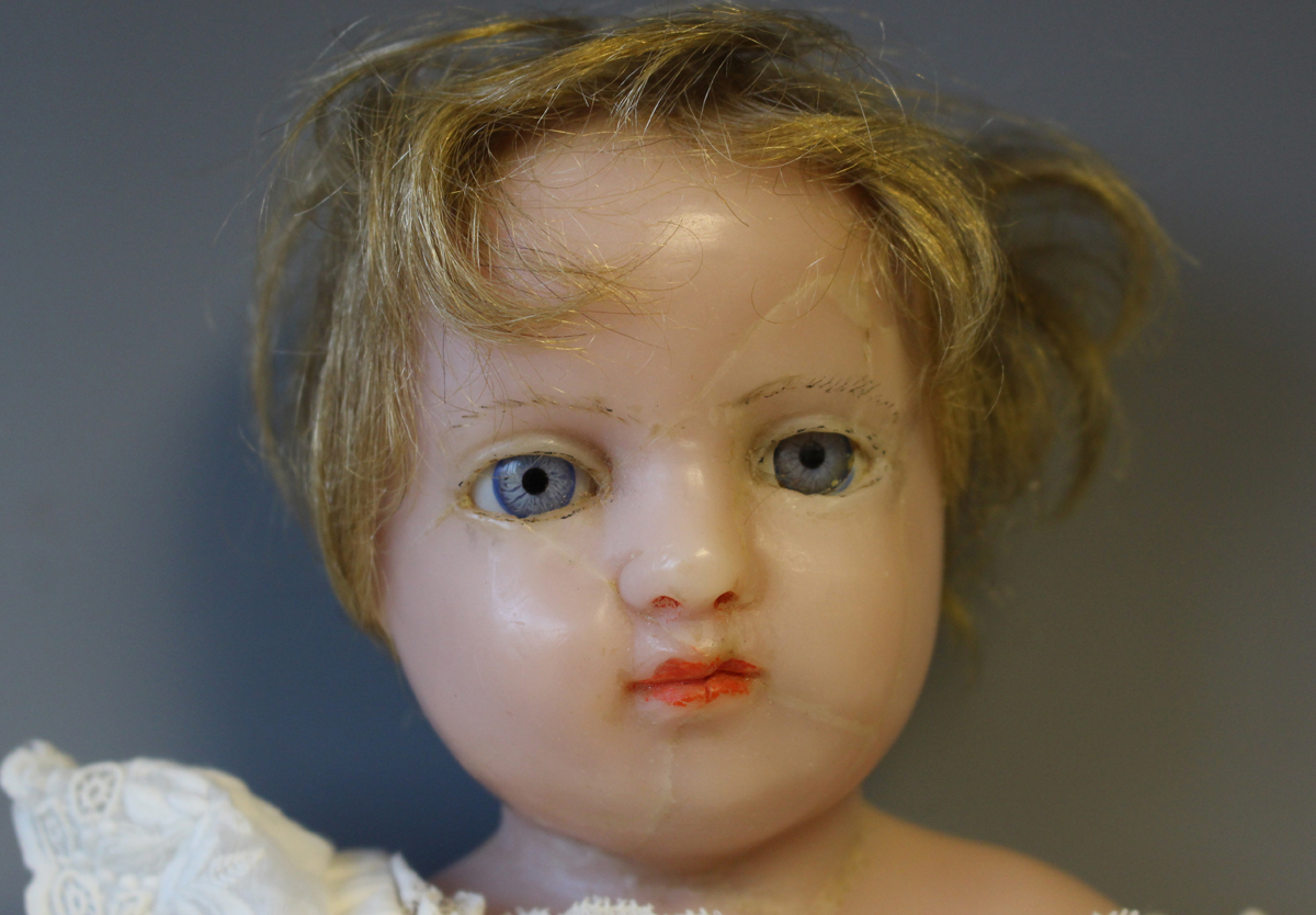 A Pierotti type wax head and shoulders doll with blonde hair, fixed blue eyes, red lips and fabric - Image 6 of 7