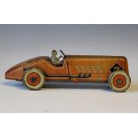 A Mettoy No. 88 tinplate clockwork boat tailed racing car with driver, race number 7 and Dunlop