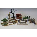 A collection of Britains plastic garden series items, including trees, fence panels, borders,