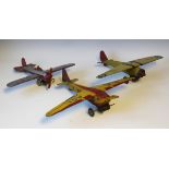 A Mettoy K2010 tinplate clockwork high-wing monoplane 'GA-AG1', finished in red and yellow, wingspan