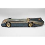 A Betal tinplate clockwork Bluebird land speed car with driver and facsimile Malcolm Campbell