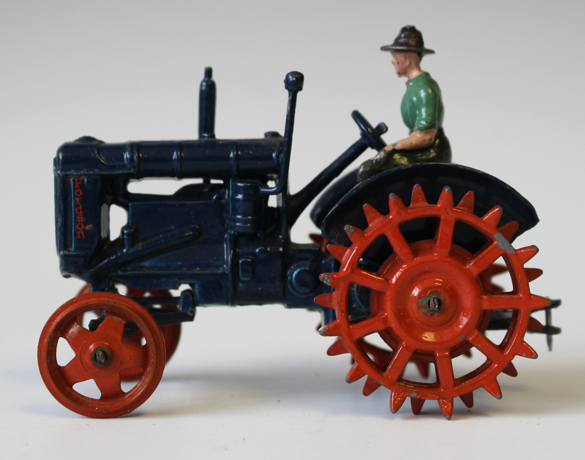 A Britains No. 127F Fordson Major tractor with spud wheels and driver, together with two disc - Image 4 of 5