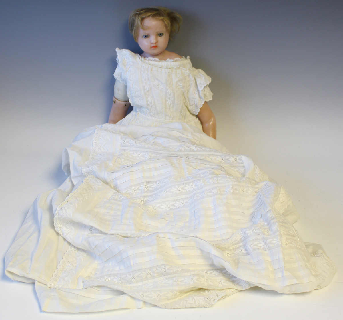 A Pierotti type wax head and shoulders doll with blonde hair, fixed blue eyes, red lips and fabric - Image 7 of 7