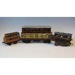 A Märklin gauge O 1st/3rd coach 1153, finished in LNWR livery, a Bing 1st luggage coach, two Bing