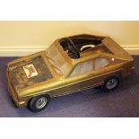 A Leeway Ford Capri plastic bodied pedal car, finished in metallic bronze with matt black bonnet,