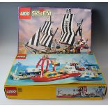 A Lego System No. 6286 Pirate Ship, boxed, a No. 6542 Launch and Load Seaport, boxed, locomotives, a