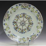 An English Delft charger, Lambeth, circa 1790-95, of Ann Gomm type, polychrome painted with a