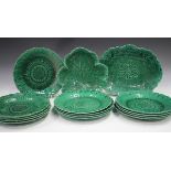 A collection of Wedgwood green glazed majolica dessert dishes, late 19th century, comprising