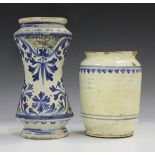 An Italian maiolica albarello, Sicily, early 18th century, of waisted form, painted in blue with a