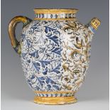 An Italian maiolica wet drug jar, probably Deruta, 17th century, the ovoid body painted to the front