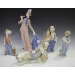 Five Lladro porcelain figures, comprising A Mile of Style, No. 6507, Pals Forever, No. 7686, and