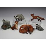 Five Beswick models of foxes and badgers, comprising Nos. 1017, 1440, 1748, 3392 and 3393,