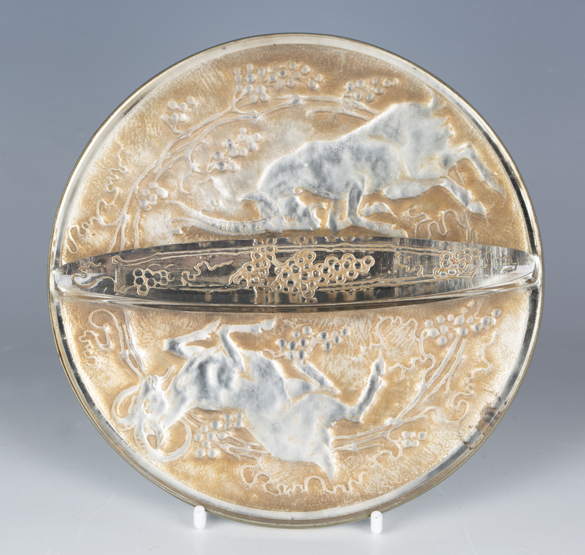 A Lalique sepia stained glass Art Deco Deux Chèvres hand mirror, designed 1927, of circular shape