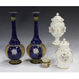 A pair of Doulton Lambeth stoneware bottle vases, late 19th century, blue glazed with floral and